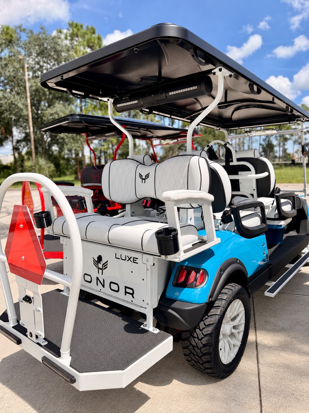 Blue Honor Luxe cart with white seating and matching white trim