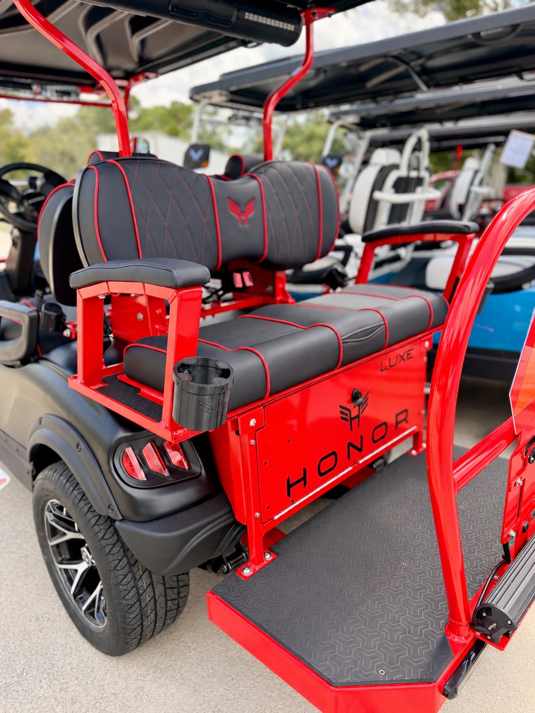 Black Honor seats with red diamond stitching, red piping and a matching red frame